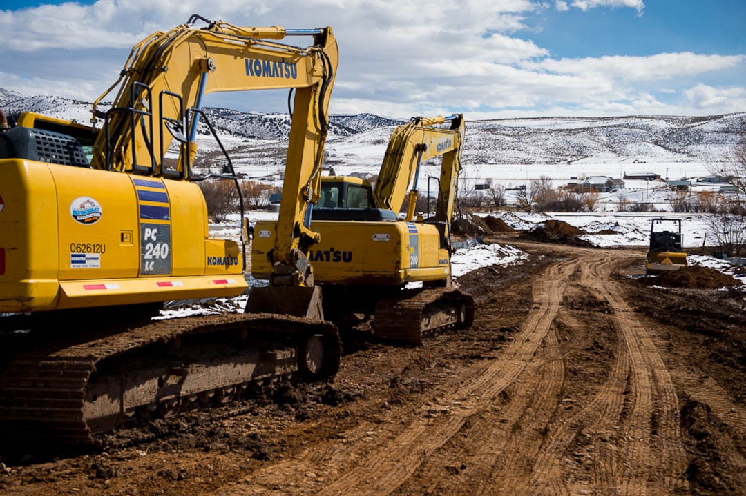 (Trent Nelson | The Salt Lake Tribune)  Excavators at the site of a new development in Coalville, Friday March 2, 2018.