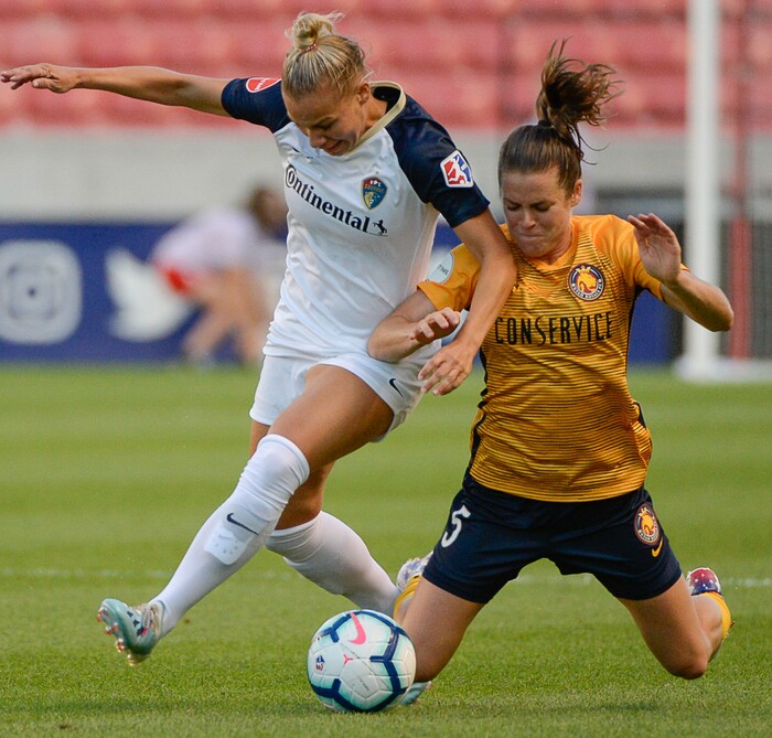 (Francisco Kjolseth  |  The Salt Lake Tribune)  North Carolina Courage defender Merritt Mathias (11) battles Utah Royals FC defender Kelley O'Hara (5) for possession as Utah Royals FC hosts the North Carolina Courage at Rio Tinto Stadium in Sandy, Utah on Saturday, July 27, 2019.