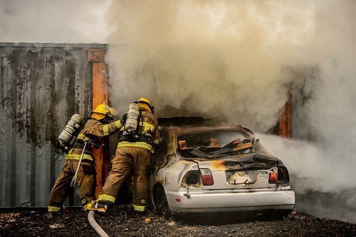 (Trent Nelson  |  The Salt Lake Tribune)  
Unified Fire recruits in a live response to a vehicle and structure fire at the Unified Fire Authority Training Center in Magna on Tuesday April 16, 2019.