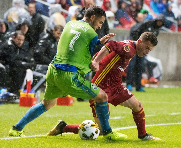 (Rick Egan  |  The Salt Lake Tribune)  Real Salt Lake forward Brooks Lennon (27) goes for the ball along with Seattle Sounders midfielder Cristian Roldan (7), in MLS soccer action, Real Salt Lake vs Seattle Sounders, in Sandy, Utah, Saturday, September 23, 2017.