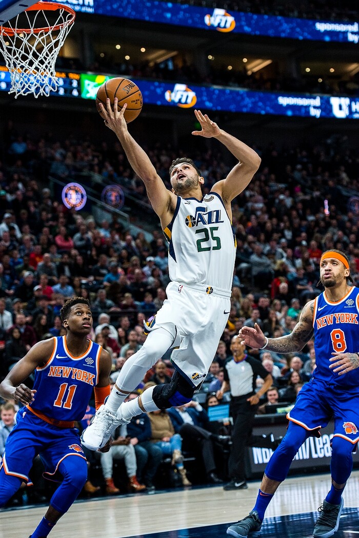 (Chris Detrick  |  The Salt Lake Tribune)  Utah Jazz guard Raul Neto (25) shoots past New York Knicks guard Frank Ntilikina (11) and New York Knicks forward Michael Beasley (8) during the game at Vivint Smart Home Arena Friday, January 19, 2018.  