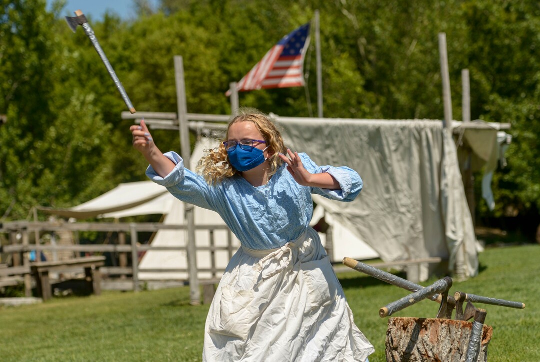 (Leah Hogsten  |  The Salt Lake Tribune) Savanna Mason, 10, learns how to throw a hatchet during Pioneer Day festivities at the American West Heritage Center in Wellsville, July 24, 2020.