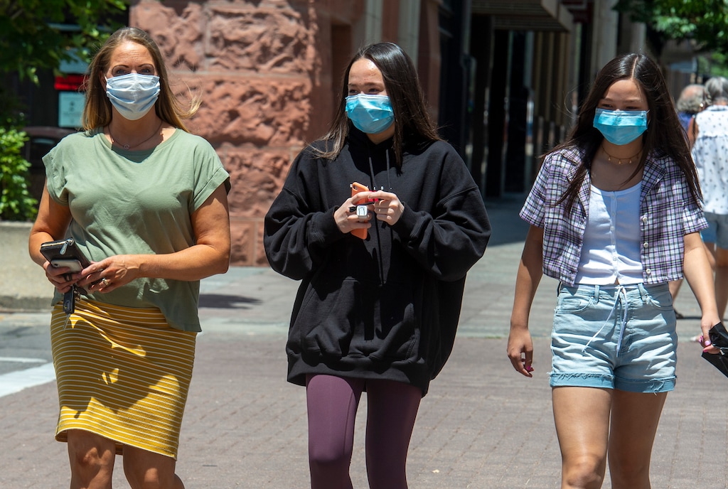 (Rick Egan  |  Tribune file photo)     Kim Phung, left, from Bountiful walks on Main Street, with her daughters, Jasmine and Addy, in downtown Salt Lake City on Friday, June 26, 2020.