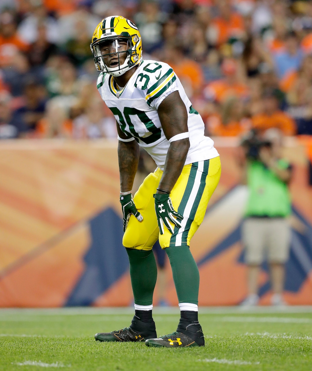 Green Bay Packers running back Jamaal Williams (30) lines up against the Denver Broncos during the first half of an NFL preseason football game, Saturday, Aug. 26, 2017, in Denver. (AP Photo/Joe Mahoney)