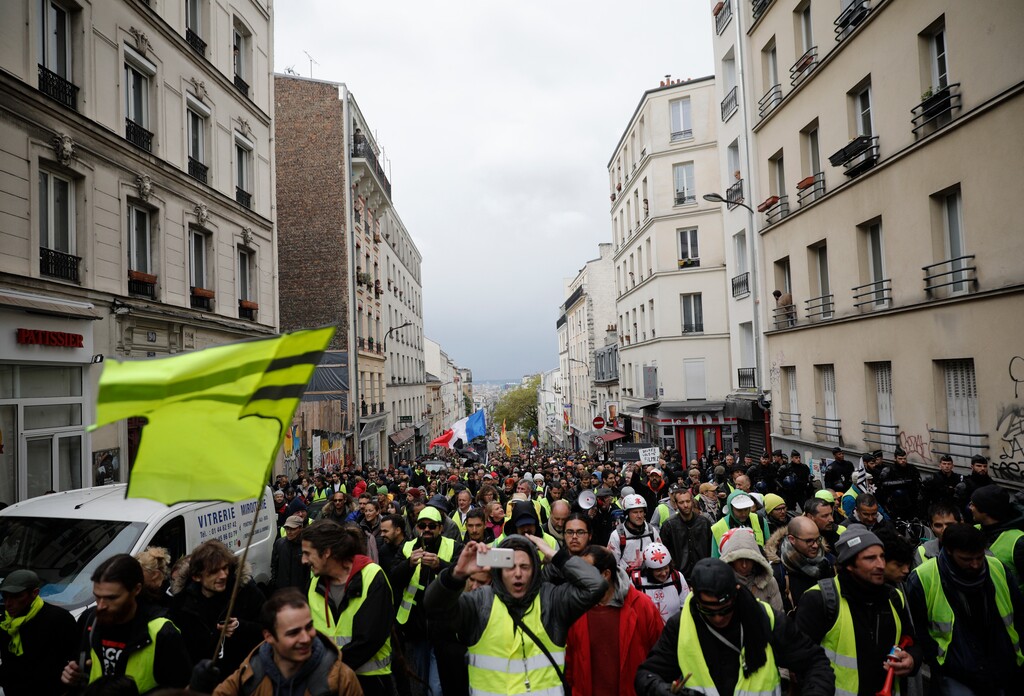 Yellow Vest protestors march in Paris, Saturday, May 4, 2019. Yellow Vest protests are taking place for the 25th consecutive week to challenge President Emmanuel Macron's economic policies. (AP Photo/Kamil Zihnioglu)