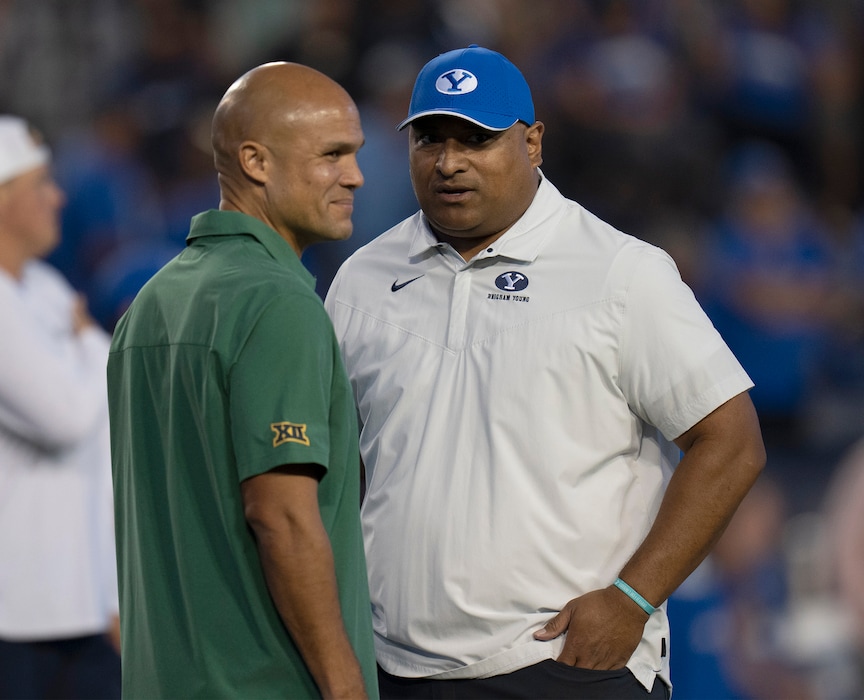 (Rick Egan | The Salt Lake Tribune) Brigham Young Cougars head coach Kalani Sitake chats with Baylor Bears head coach Dave Aranda, on the field before football action between the Brigham Young Cougars and the Baylor Bears at LaVell Edwards Stadium in Provo, on Saturday, Sept. 10, 2022.