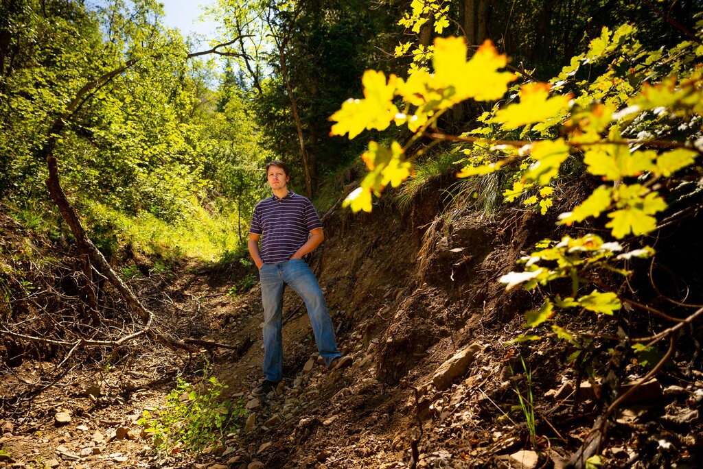 (Trent Nelson | The Salt Lake Tribune)  Kirk Richards stands in a diversion ditch near his Woodland Hills home on Thursday, Aug. 15, 2019.