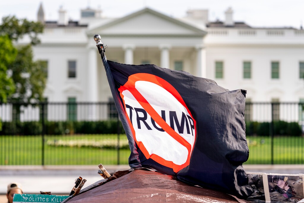 An anti-President Donald Trump flag is visible in Lafayette Square outside the White House on the fourth night of the Republican National Convention, Thursday, Aug. 27, 2020, in Washington. (AP Photo/Andrew Harnik)