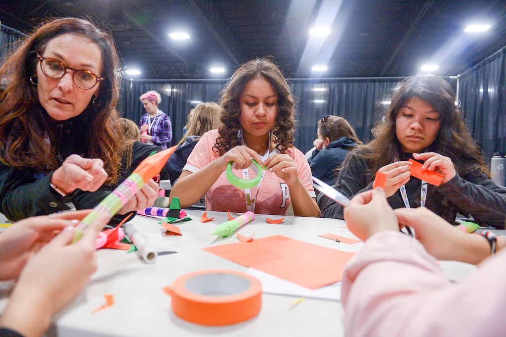 (Leah Hogsten | The Salt Lake Tribune) Students learn how to make a paper rocket in February at a SheTech Explorer Day at the Mountain America Expo Center in Sandy — an event held to help interest girls in science and math. Research from Utah Valley University on the State of Women Leaders in Utah Business found that the small percentage of women in top-level jobs at Utah businesses has decreased in 2014, and the report speculates that could be connected to the number of male leaders who come with Utah’s growing tech industry.