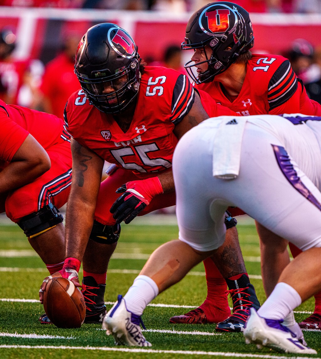 (Trent Nelson  |  The Salt Lake Tribune) Utah Utes offensive lineman Nick Ford (55) and Utah Utes quarterback Charlie Brewer (12) as the Utah Utes host the Weber State Wildcats in Salt Lake City on Thursday, Sept. 2, 2021.