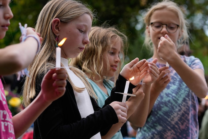 (Francisco Kjolseth  |  The Salt Lake Tribune) Schoolmates, family and friends gather for a candlelight memorial at Laird Park in Salt Lake City on Wednesday, May 22, 2024, to honor Adlai Owen. Police say Adlai’s father, Sam Owen, fatally shot Adlai before killing himself in an apparent murder-suicide on Saturday, May 18, 2024.