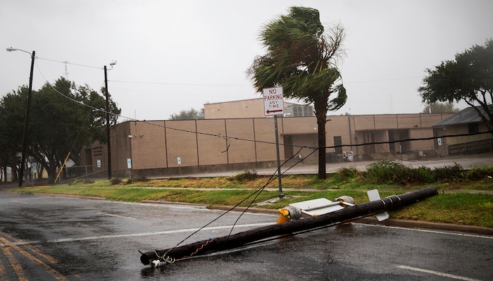 (Nick Wagner | Austin American-Statesman via AP) A power pole lays in the middle of a street as Hurricane Harvey makes landfall in Corpus Christi, Texas, on Friday, Aug. 25, 2017. Hurricane Harvey smashed into Texas late Friday, lashing a wide swath of the Gulf Coast with strong winds and torrential rain from the fiercest hurricane to hit the U.S. in more than a decade.