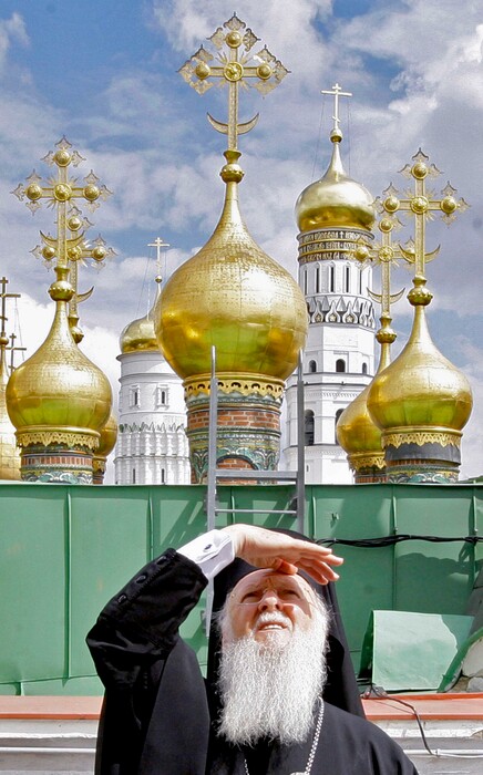(Dmitry Astakhov/Sputnik Government Pool Photo via AP, File) In this Tuesday, May 25, 2010, photo, Ecumenical Patriarch Bartholomew I of Constantinople shields his eyes from the sun as he stands on a roof overlooking the Kremlin in Moscow, Russia.
