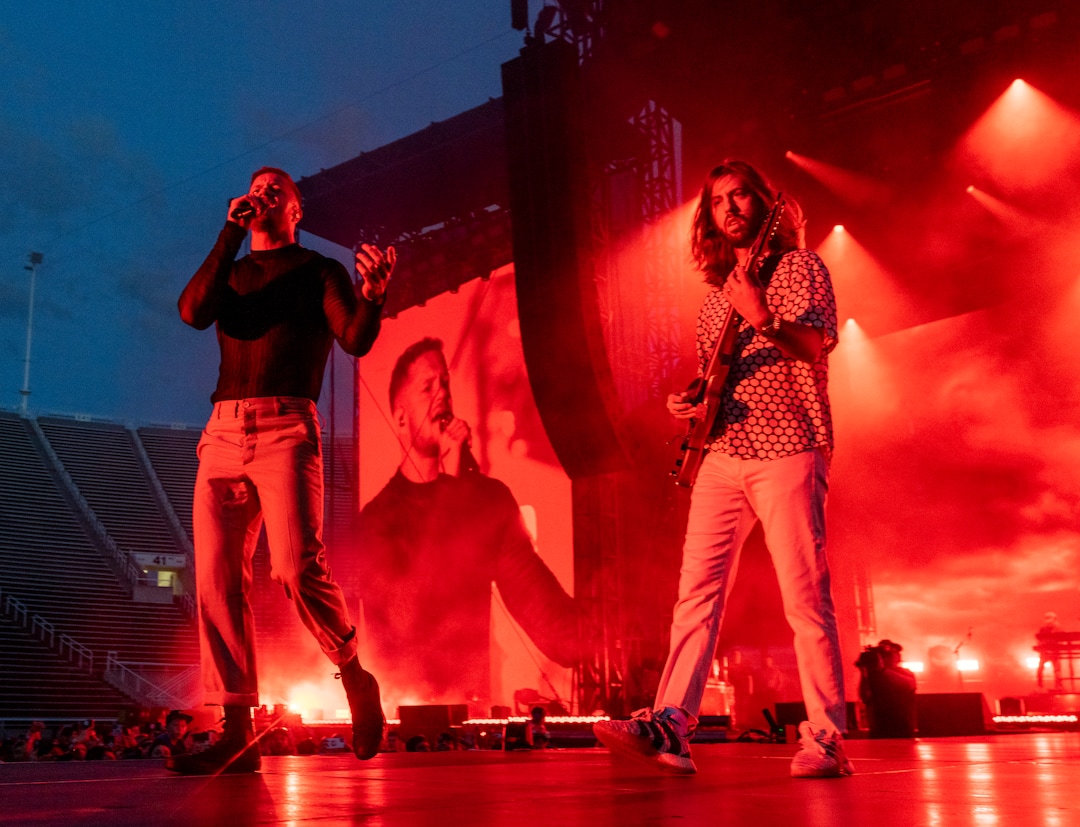 (Rick Egan | The Salt Lake Tribune) Dan Reynolds sings and Wayne Sermon plays guitar as Imagine Dragons performs at Rice-Eccles Stadium, on Friday, Aug. 5, 2022.