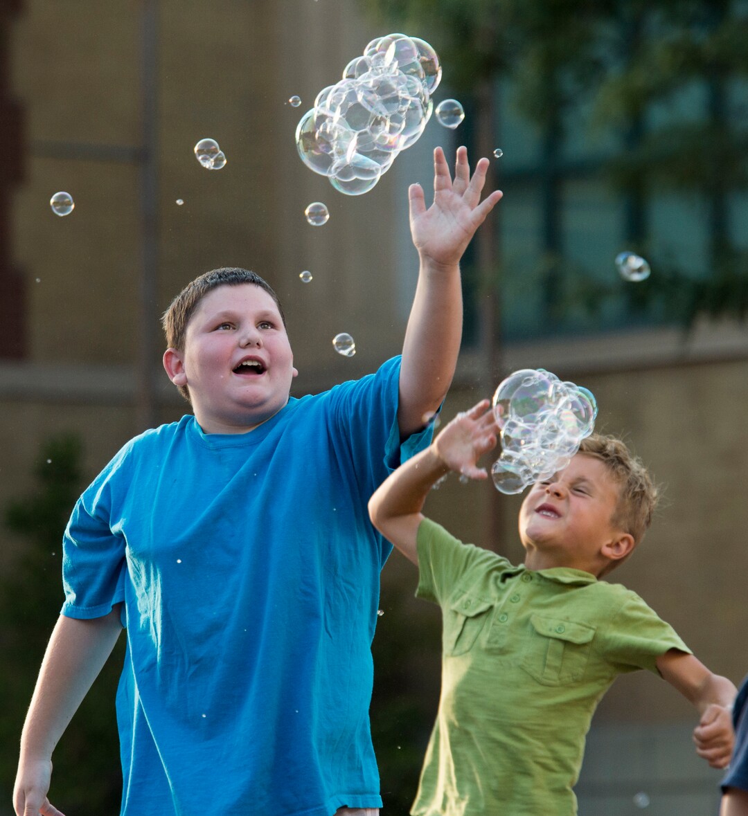 (Rick Egan  |  The Salt Lake Tribune)      Kids chase bubbles as they fall from the bubble tower at the Utah State Fair, Thursday, Sept. 6, 2018.