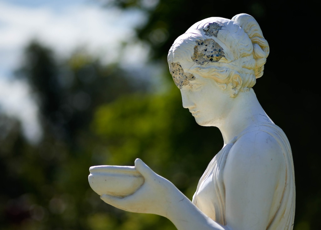 (Francisco Kjolseth | The Salt Lake Tribune) A statue of Hebe, the Greek goddess of youth, shows signs of aging at Salt Lake City's International Peace Gardens on Wednesday, Aug. 23, 2023. City Council members voted unanimously this month to approve a nearly $40 million capital improvement program, which includes $325,000 to spruce up the gardens.