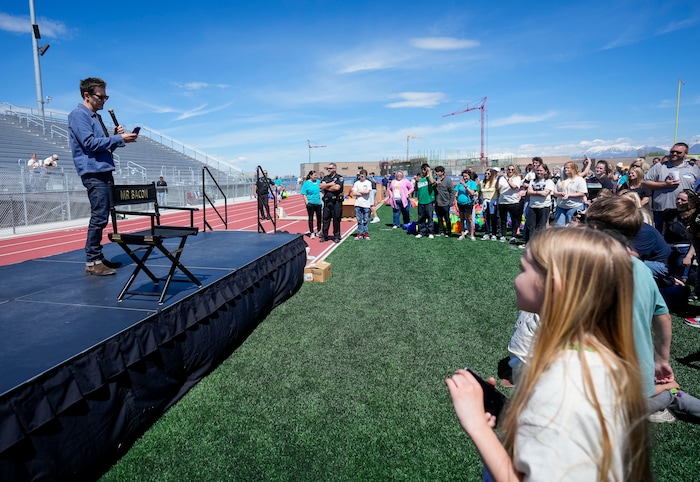 (Bethany Baker | The Salt Lake Tribune) Kevin Bacon prepares to take a video with the crowd following a charity event to commemorate the 40th anniversary of the movie "Footloose" on the football field of Payson High School in Payson on Saturday, April 20, 2024.