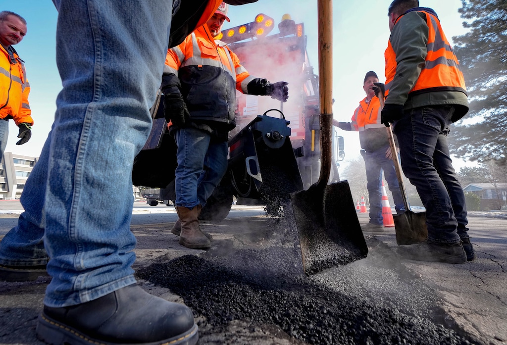 (Francisco Kjolseth | The Salt Lake Tribune) A Salt Lake City crew works on filling potholes along North Star Drive near Redwood Road on Wednesday, Feb. 1, 2023.