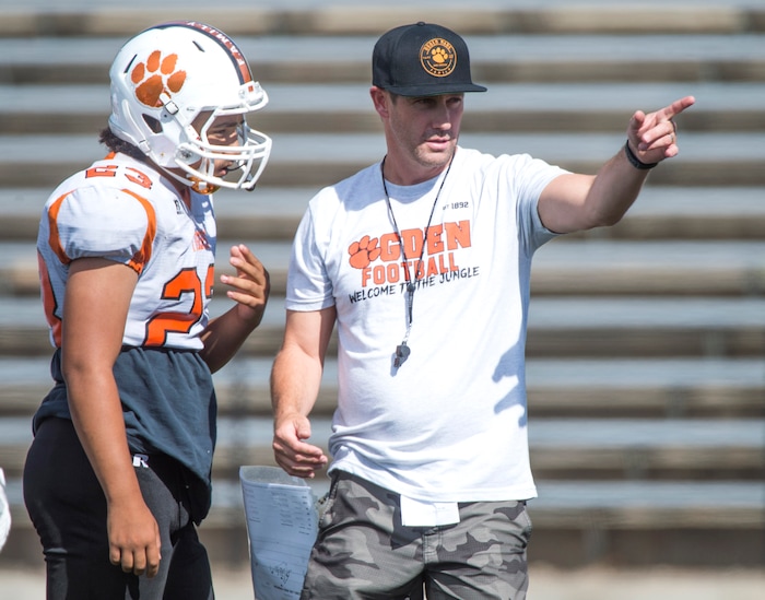 (Rick Egan  |  The Salt Lake Tribune)  Ogden High head coach, Erik Thompson talks to players during football practice. The mood at practice has changed after the team broke its 36-game losing streak last week. Wednesday, September 13, 2017.