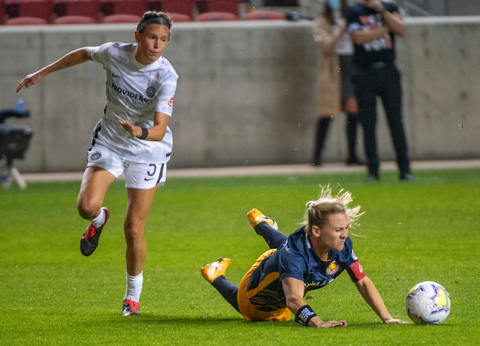 (Rick Egan | The Salt Lake Tribune) Utah Royals FC forward Amy Rodriguez (8) hits the ground as she goes for the ball along with Portland Thorns FC defender Emily Menges (5), in soccer action between Utah Royals FC and Portland Thorns FC at Rio Tinto Stadium, on Saturday, Oct. 3, 2020.
