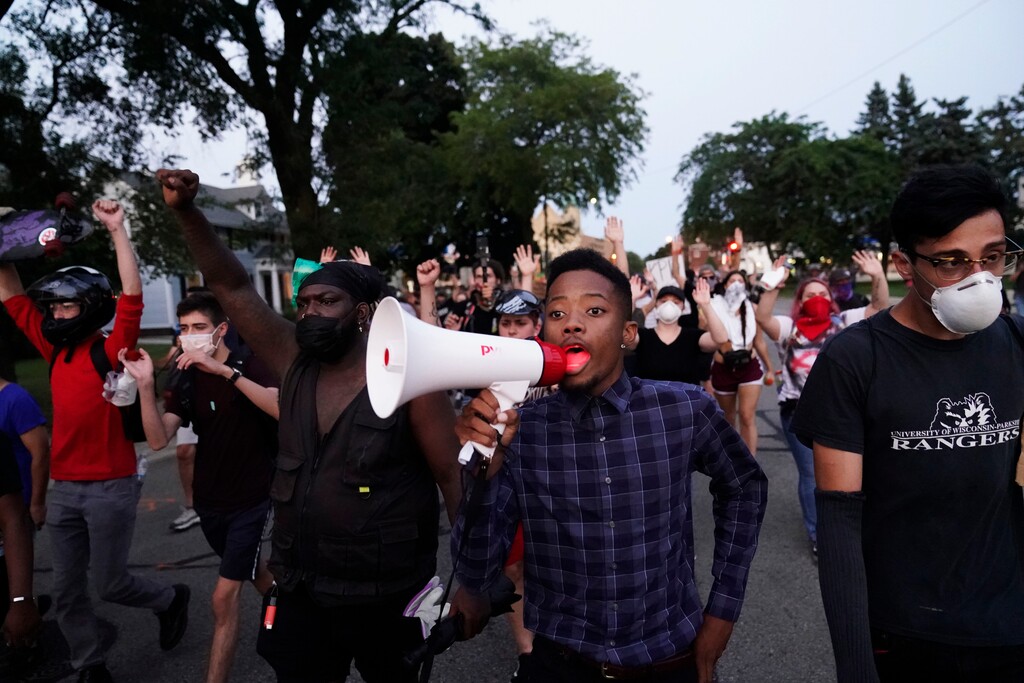 (David Goldman | AP) Protesters march against the Sunday police shooting of Jacob Blake in Kenosha, Wis., Wednesday, Aug. 26, 2020.