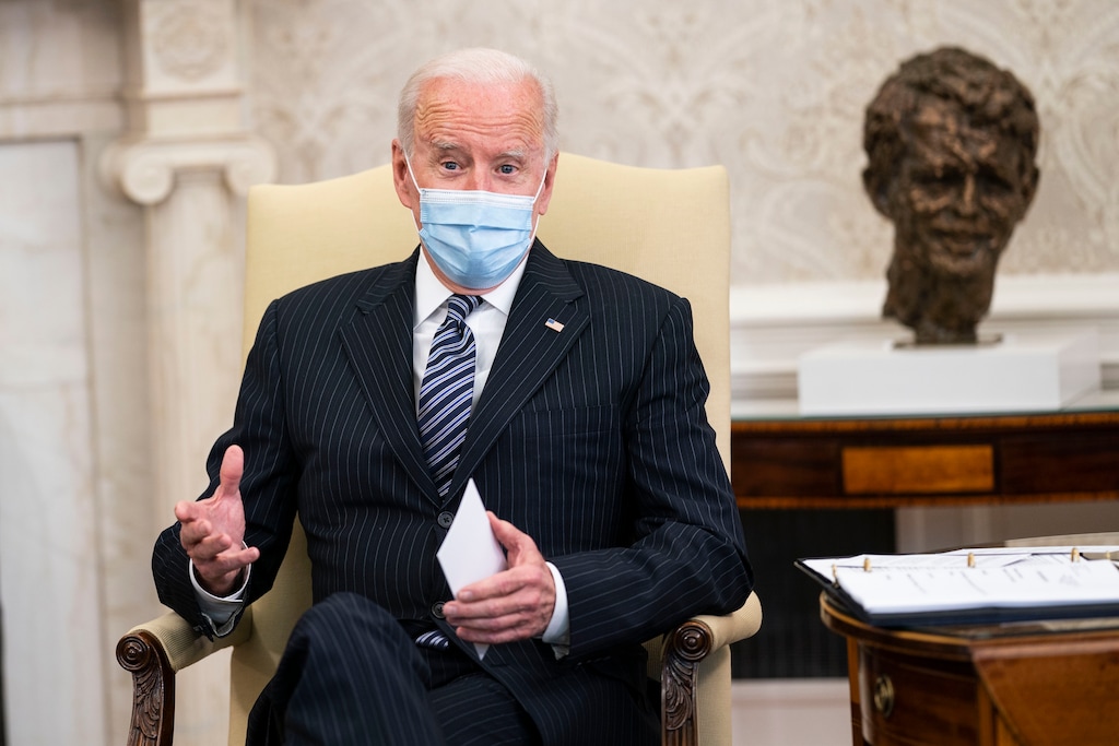 (Doug Mills | The New York Times) President Joe Biden makes remarks during a meeting with a bipartisan group of members of Congress to discuss the American Jobs Plan, in the Oval Office of the White House in Washington on Monday, April, 19, 2021. At right is a bust of Robert F. Kennedy.