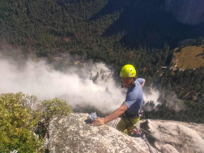 In this photo provided by Peter Zabrok, climber Ryan Sheridan who had just reached the top of El Capitan, a 7,569-foot (2,307 meter) formation, when a rock slide let loose below him Thursday, Sept. 28, 2017, in Yosemite National Park, Calif. It was not immediately clear if there were new casualties, a day after another slab dropped from El Capitan, killing a British climber and injuring a second. (Peter Zabrok via AP)