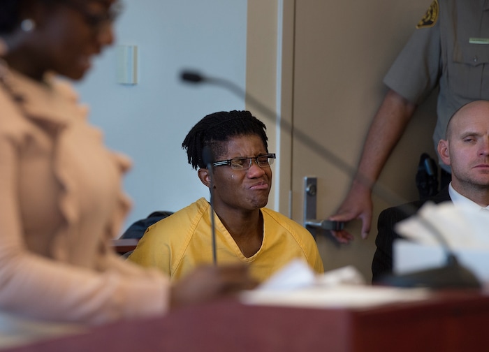 Scott Sommerdorf | The Salt Lake Tribune
Gerald Grant reacts as his sister, Shatiria Grant, as she talks about him during the sentencing for Grant for shooting and killing two men and a teenage boy inside an SUV in South Salt Lake nearly two years ago. Sentencing was in front of 3rd District Judge Vernice Trease, Thursday, March 8, 2018.