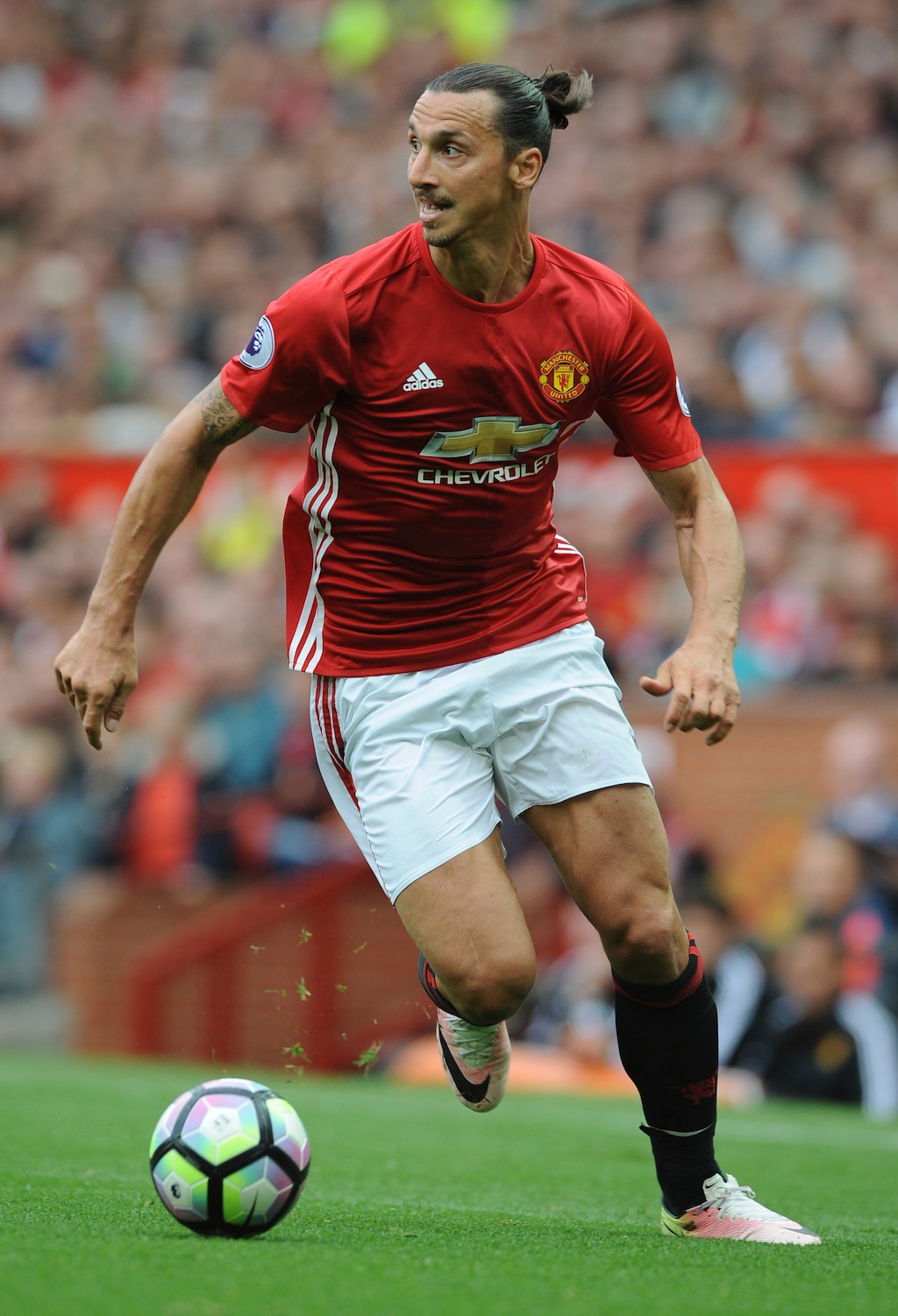 FILe - In this Sept. 24, 2016, file photo, Manchester United's Zlatan Ibrahimovic dribbles the ball during an English Premier League soccer match against Leicester City at Old Trafford in Manchester, England. Sources with knowledge of the deal say Ibrahimovic has signed a two-year contract with Major League Soccer to leave Manchester United and join the LA Galaxy. The sources spoke to The Associated Press on the condition of anonymity Thursday, March 22, 2018, because the deal had not been announced. The agreement was first reported by the Los Angeles Times.  (AP Photo/Rui Vieira, File)