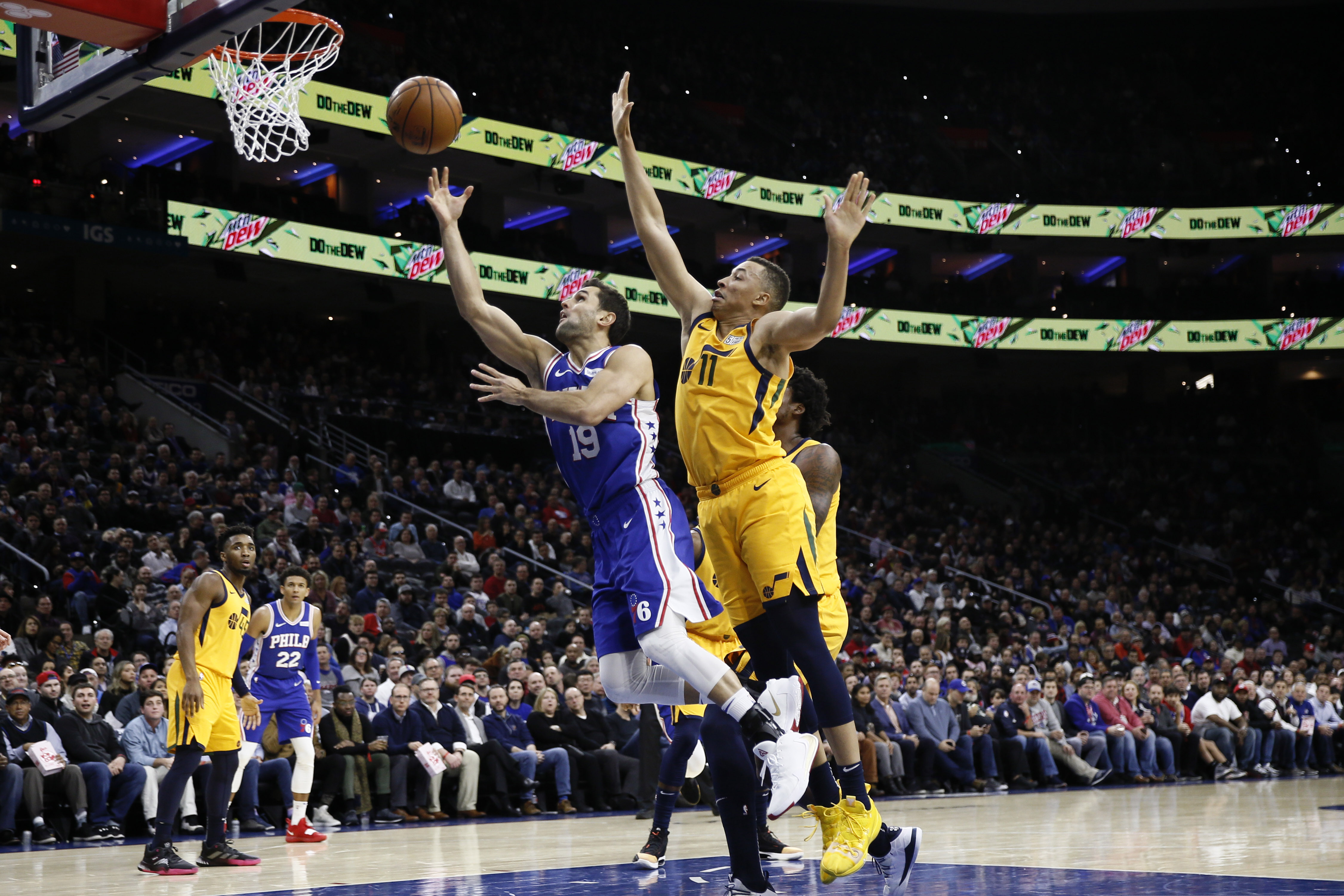 Philadelphia 76ers' Raul Neto (19) goes up to shoot against Utah Jazz's Dante Exum (11) during the first half of an NBA basketball game, Monday, Dec. 2, 2019, in Philadelphia. (AP Photo/Matt Slocum)