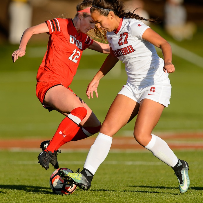 (Trent Nelson | The Salt Lake Tribune) Utah's Holly Daugirda (12) and Stanford's Samantha Hiatt (27) as the University of Utah hosts Stanford, NCAA Women's Soccer in Salt Lake City Thursday October 5, 2017.