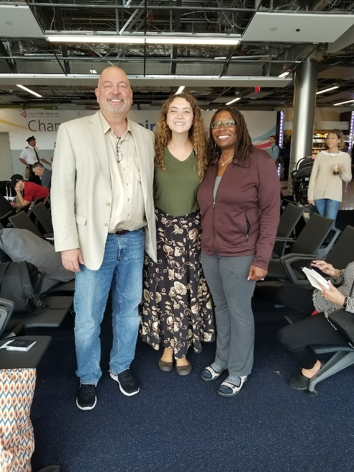 Courtesy | Michael McDonald. Mormon missionary Erin McDonald meets by chance with her parents at the Atlanta airport while evacuating from Puerto Rico on September 23, 2017.