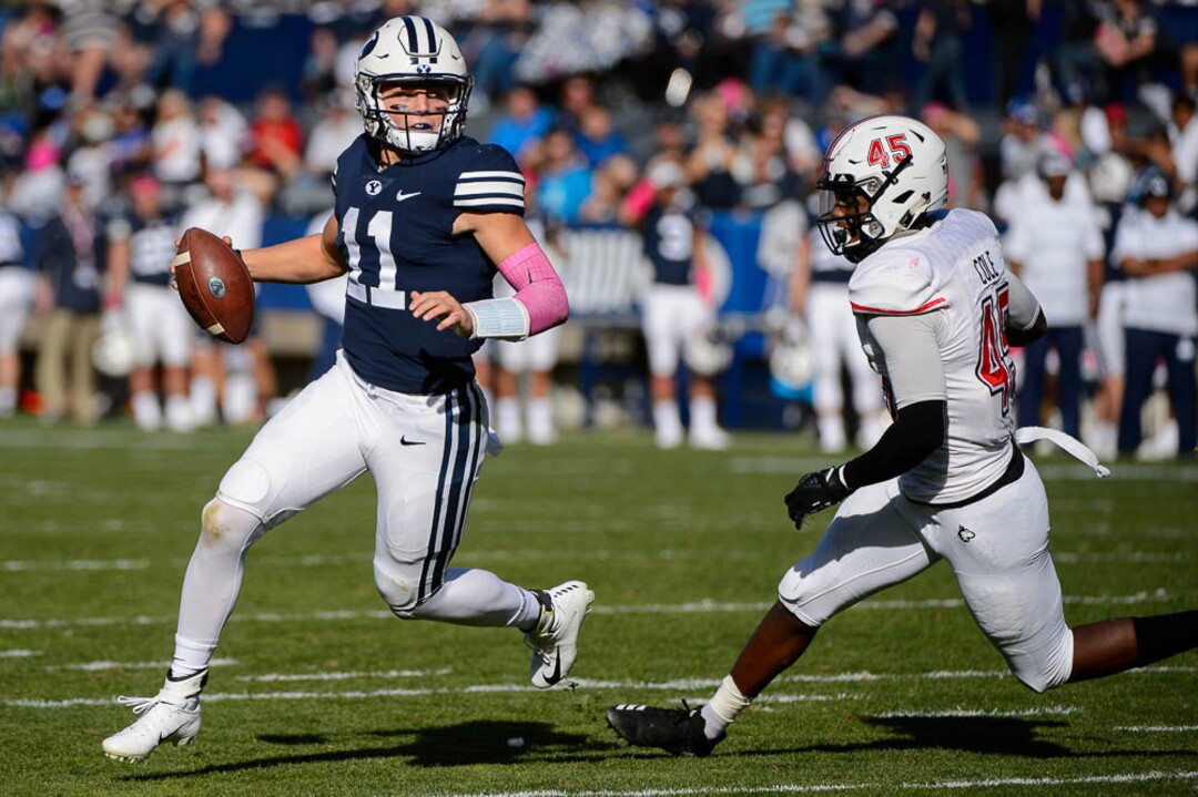 (Trent Nelson | The Salt Lake Tribune)  Brigham Young Cougars quarterback Zach Wilson (11) runs the ball as BYU hosts Northern Illinois, NCAA football in Provo, Saturday Oct. 27, 2018.