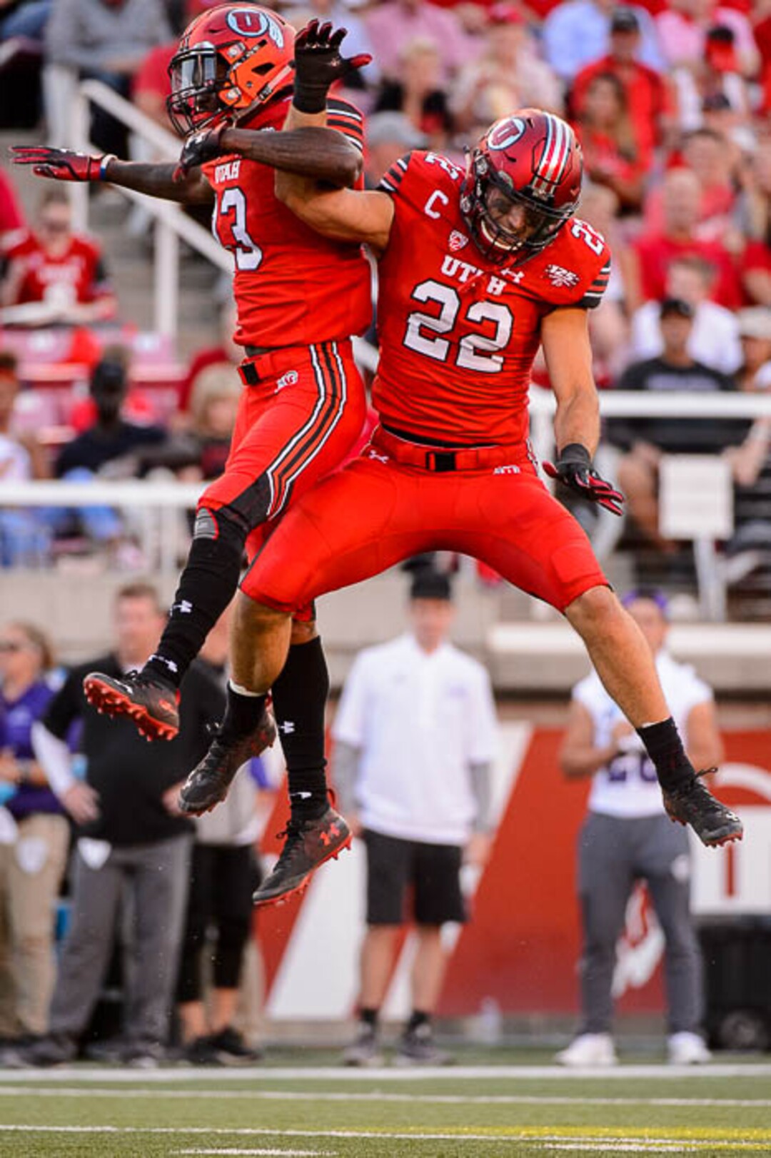 (Trent Nelson | The Salt Lake Tribune)  Utah Utes defensive back Marquise Blair (13) and Utah Utes linebacker Chase Hansen (22) celebrate a turnover as the University of Utah Utes host the Weber State Wildcats, Thursday Aug. 30, 2018 at Rice-Eccles Stadium in Salt Lake City.
