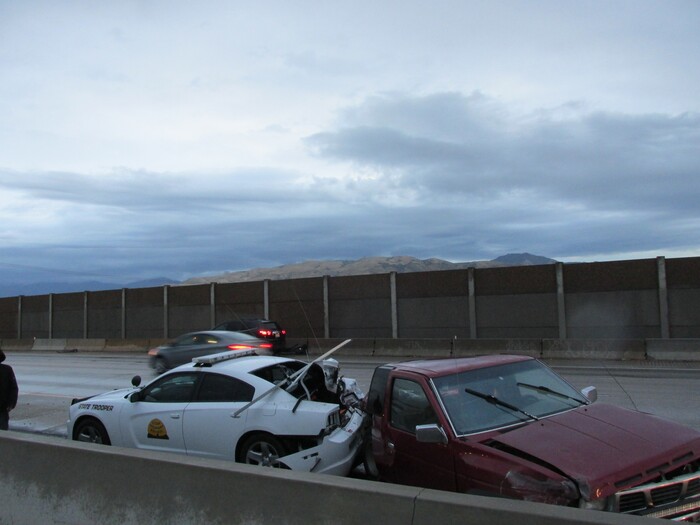 (Courtesy Utah Highway Patrol) A pickup truck slammed into the rear end of a Utah Highway Patrol patrol car early Friday, leaving a trooper with minor injuries.