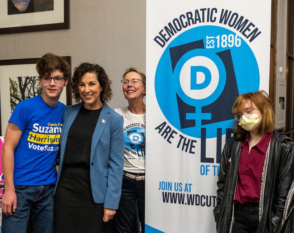 (Rick Egan | The Salt Lake Tribune) Candidate Suzanne Harrison, second from left, poses for a photo with supporters at the Sheraton in Salt Lake City, on Tuesday, Nov. 8, 2022.