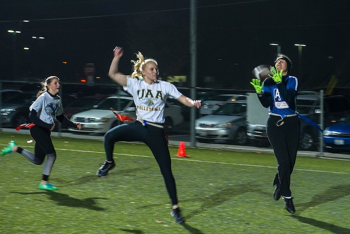 (Chris Detrick | The Salt Lake Tribune) Team A Lot's Denise Stephens makes a catch during the flag football team game against Sim Team at North University Fields in Provo Thursday, November 30, 2017.