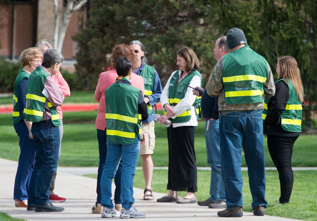 (Rick Egan  |  The Salt Lake Tribune)   Emergency response captains wear their green vests as they meet at an emergency assembly point in Presidents Circle on the University of Utah campus, during the Great Utah ShakeOut Annual Statewide Earthquake Drill Thursday, April 19, 2018.