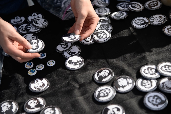 (Francisco Kjolseth  |  The Salt Lake Tribune) Pins with many of the faces of those killed by police are laid out as people gather for a vigil on the six-year anniversary of Dillon Taylor’s death by the murals of those killed by police near 800 South and 300 West in Salt Lake City on Tuesday, August 11, 2020.