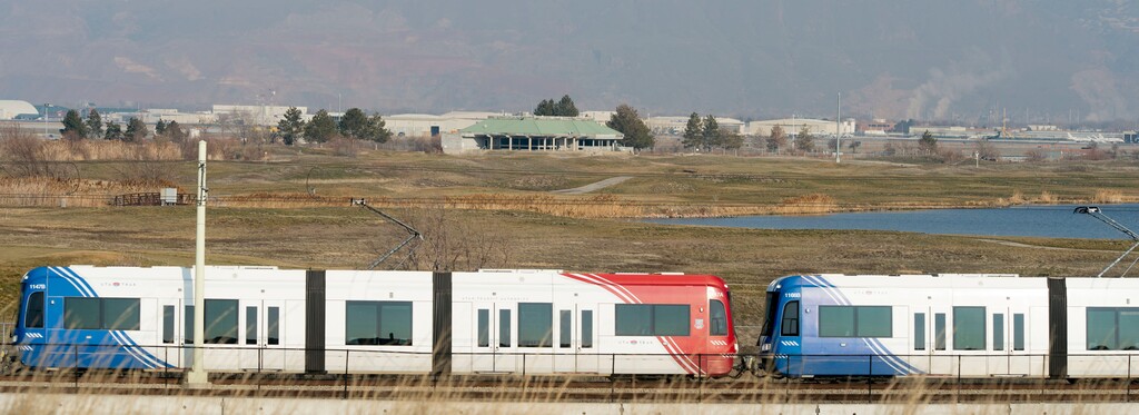 (Steve Griffin | Tribune file photo) A Green Line TRAX train travels near the former Wingpointe Golf Course near Salt Lake City International Airport on Jan. 17, 2017.
