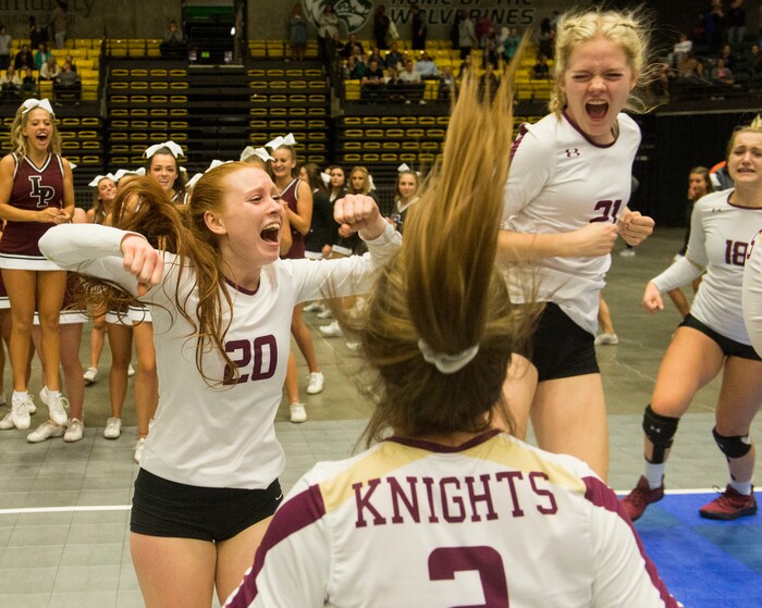 (Rick Egan  |  The Salt Lake Tribune)    The Lone Peak Knights celebrate their win over the Pleasant Grove Vikings, for the 6A volleyball championship, at Utah Valley University, Saturday, November 4, 2017.