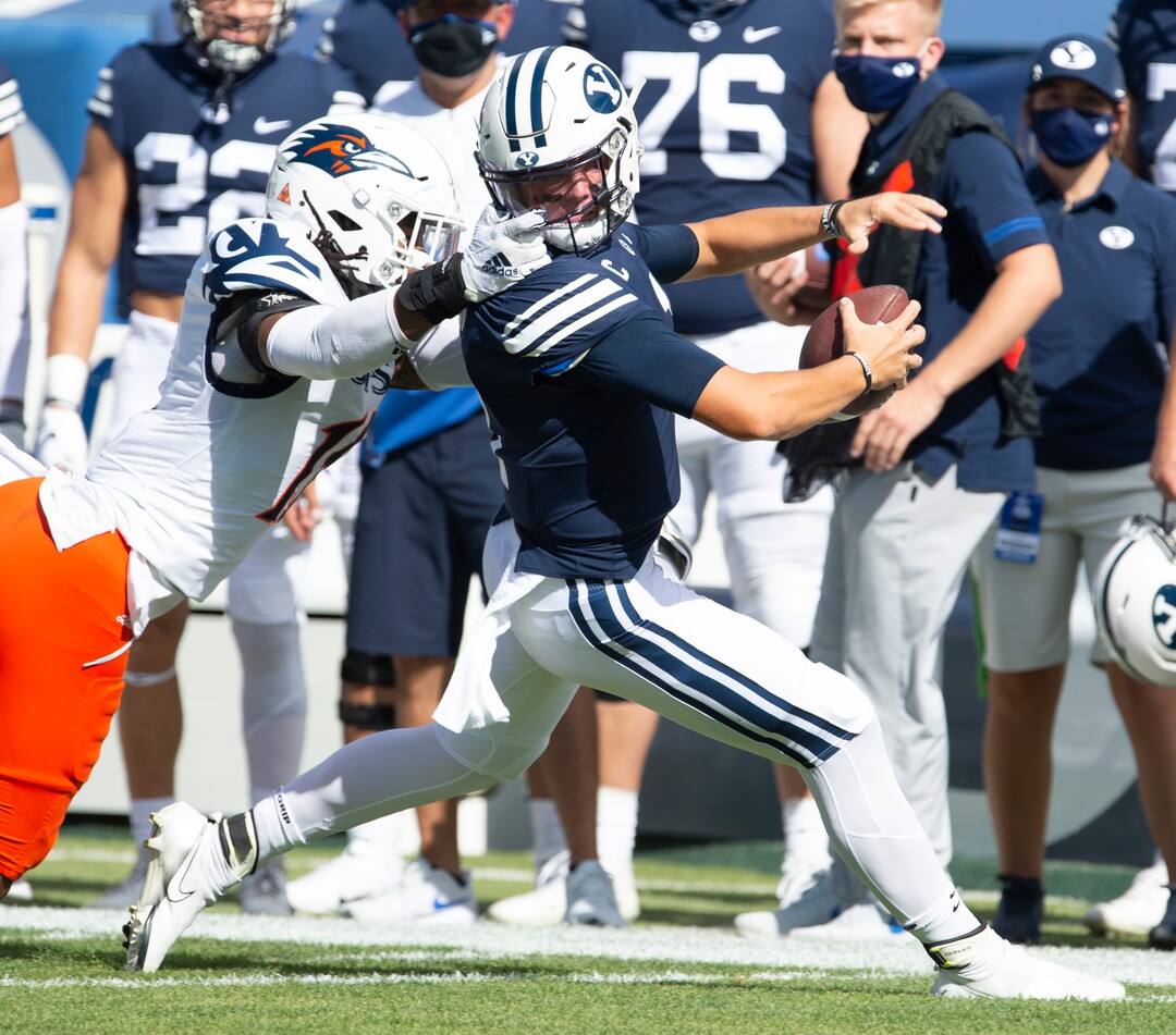 (Rick Egan  |  The Salt Lake Tribune)    UTSA Roadrunners linebacker Trevor Harmanson (15) grabs Brigham Young Cougars quarterback Zach Wilson (1) by the face mask, in football action between the Brigham Young Cougars and the UTSA Roadrunners, at Lavell Edwards stadium, Saturday, Oct. 10, 2020.