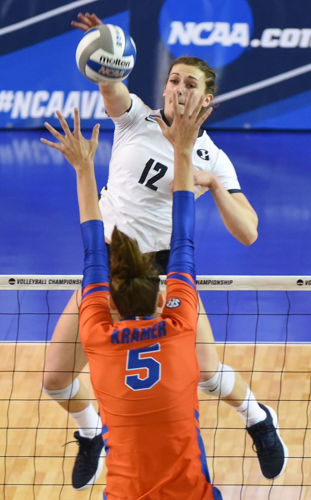 (Francisco Kjolseth  |  The Salt Lake Tribune)  BYU's Roni Jones-Perry spikes one past Rachel Kramer of Florida  during their NCAA Tournament Round of 16 match at Smith Fieldhouse, Friday, Dec. 7, 2018.
