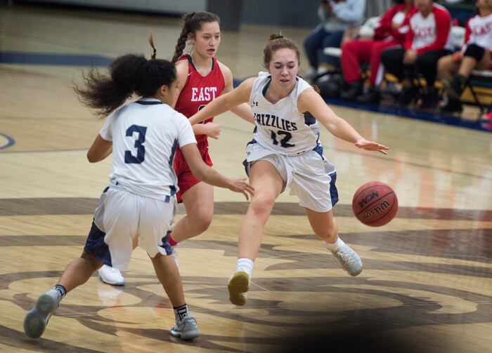 (Scott Sommerdorf | The Salt Lake Tribune)
Copper Hills' Taela Laufiso reaches for a loose ball during second half play as Copper Hills defeated East 82-62, Friday, December 29, 2017.
