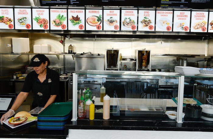(Francisco Kjolseth  |  The Salt Lake Tribune)  Fatme Soweidan prepares an order at Beirut Cafe, a Lebanese restaurant in Murray.