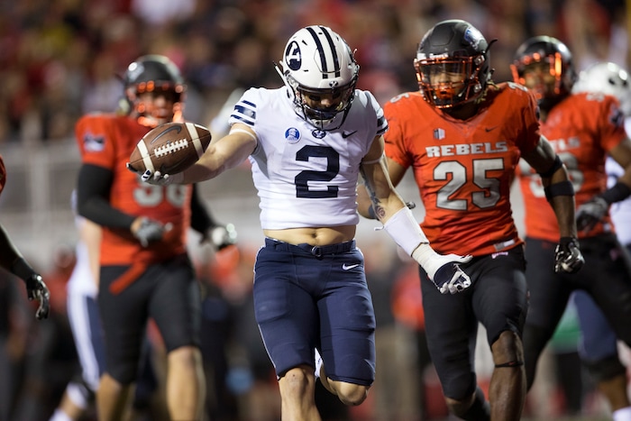 Brigham Young Cougars running back Squally Canada (22) runs the ball against the UNLV Rebels during an NCAA college football game Friday, Nov. 10, 2017, in Las Vegas. (Erik Verduzco/Las Vegas Review-Journal via AP)