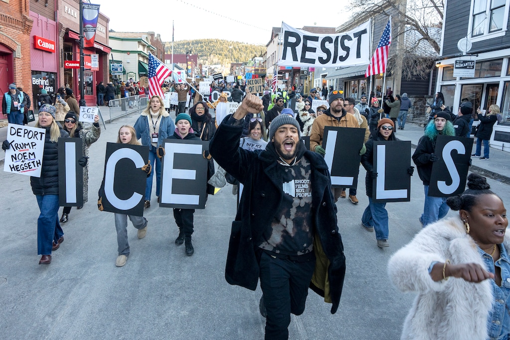 (Rick Egan | The Salt Lake Tribune) Terrance Patton-Hill leads a march down Main Street in Park City during a protest against federal immigration actions in Park City on Monday, Jan. 26, 2026.