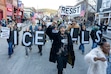 (Rick Egan | The Salt Lake Tribune) Terrance Patton-Hill leads a march down Main Street in Park City during a protest against federal immigration actions in Park City on Monday, Jan. 26, 2026.