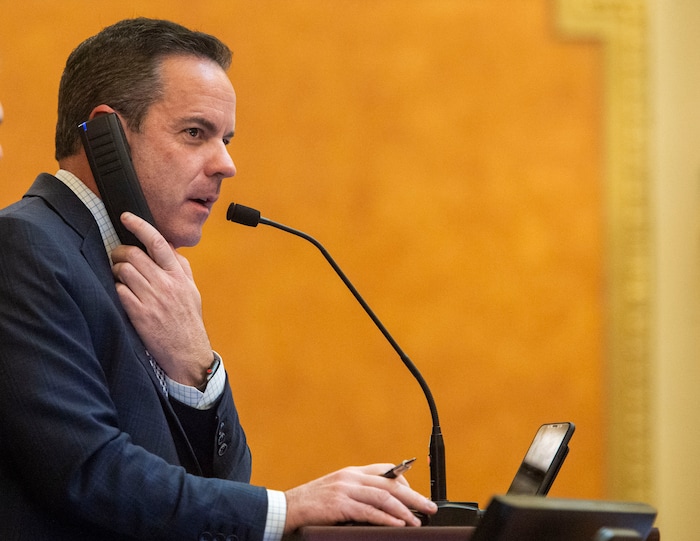 (Rick Egan  |  The Salt Lake Tribune)  Speaker of the House Brad Wilson takes a phone call during proceedings in the House, late in the evening, on the final day of the 2019 legislature, Thursday, March 14, 2019. 


