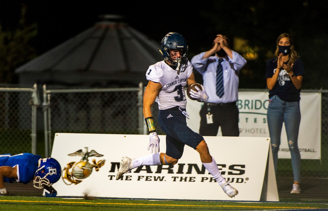 (Rick Egan  |  The Salt Lake Tribune)    Corner Canyon receiver, Cody Hagen out runs the Bingham defender to score touchdown for the Chargers, in prep action between the Bingham Miners and the Corner Canyon Chargers, at Bingham High on Friday, Aug. 28, 2020.